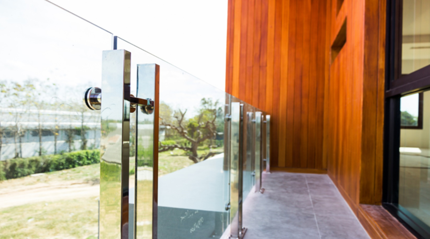 Tempered glass is seen installed in a balcony of a house.