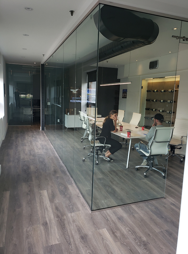 An office with a decorative glass partition