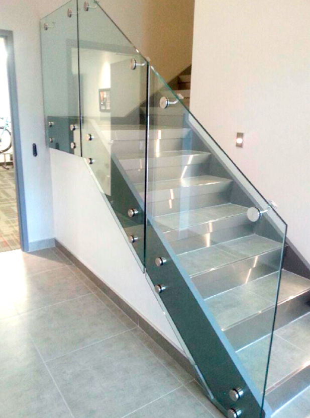 An open stairwell with glass railings